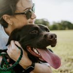 woman hugging a dog